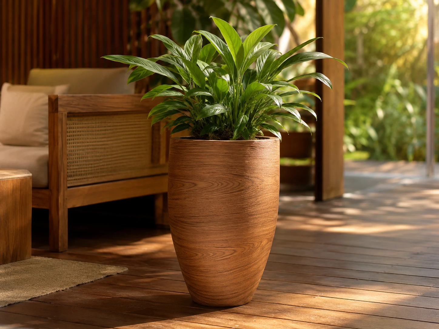 LEAFO planter in wood-grain finish with plant on a timber terrace